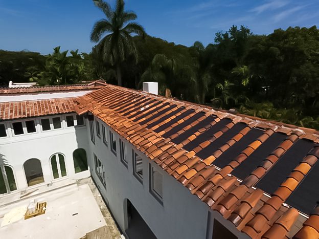 An aerial view of a house with a tile roof.