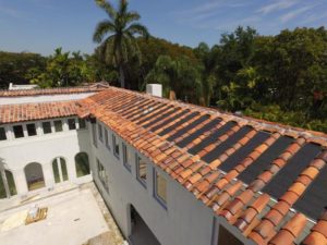 An aerial view of a house with a tile roof.