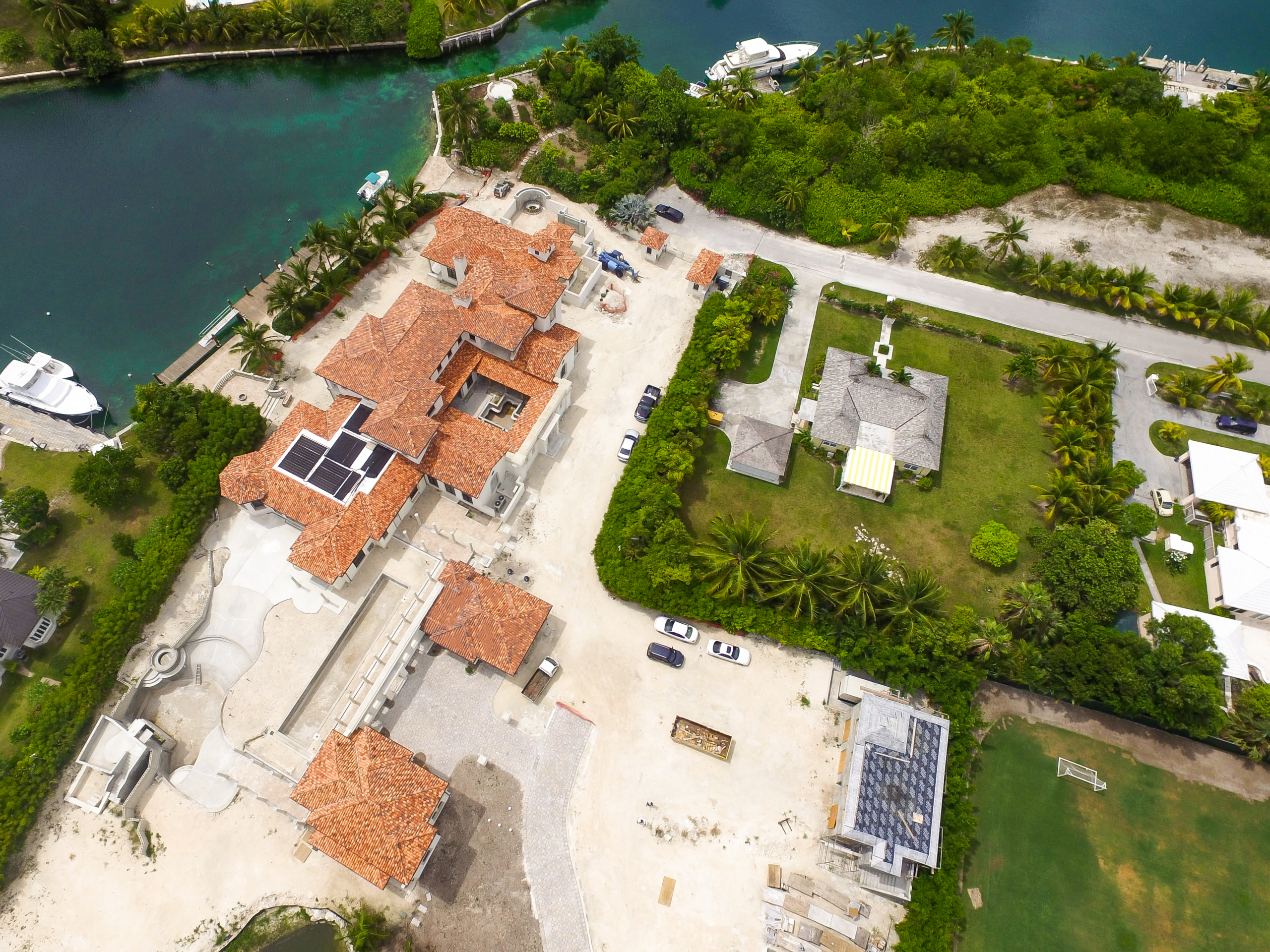 An aerial view of a house near the water.